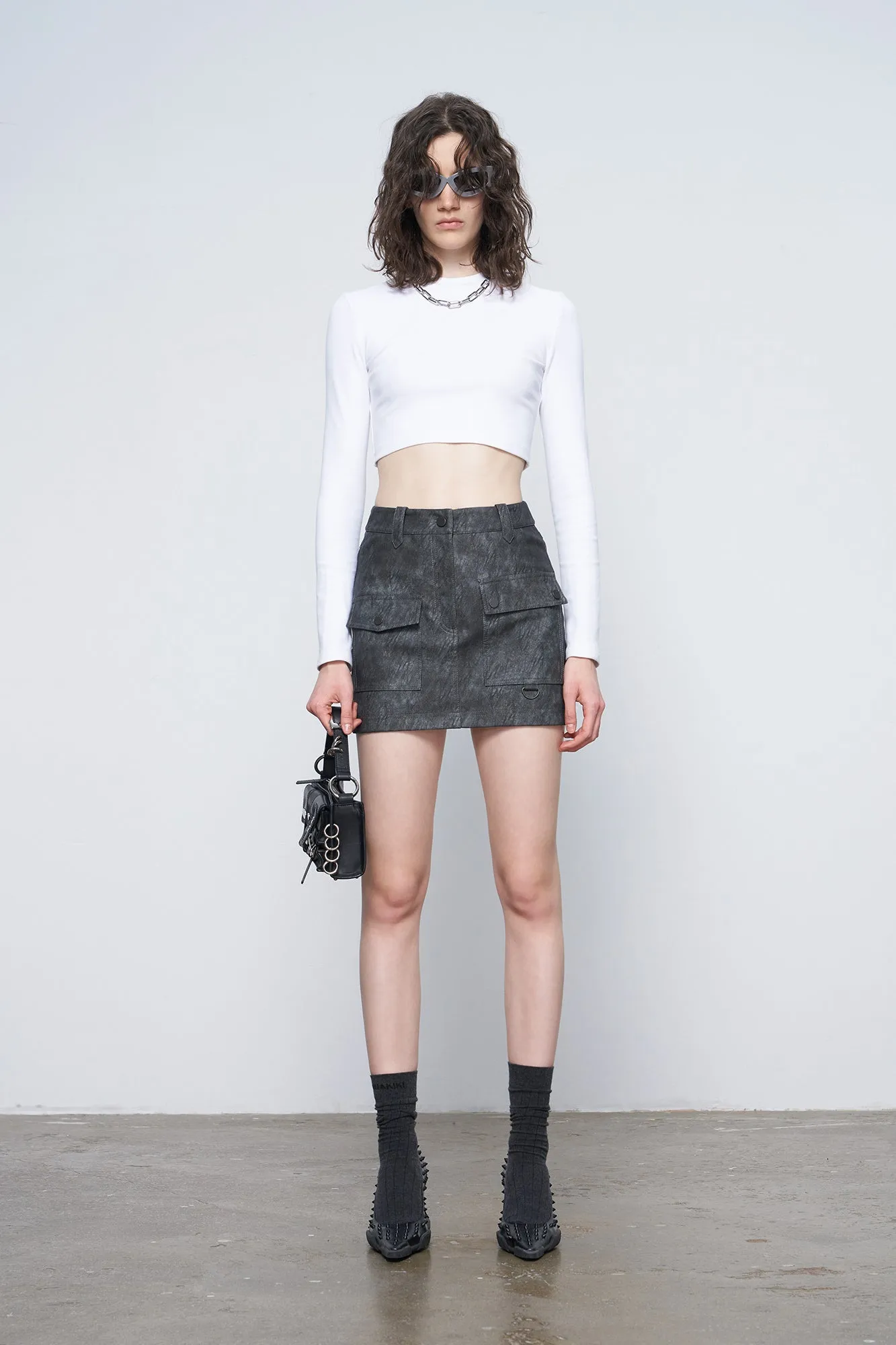 Irregular pocket leather skirt