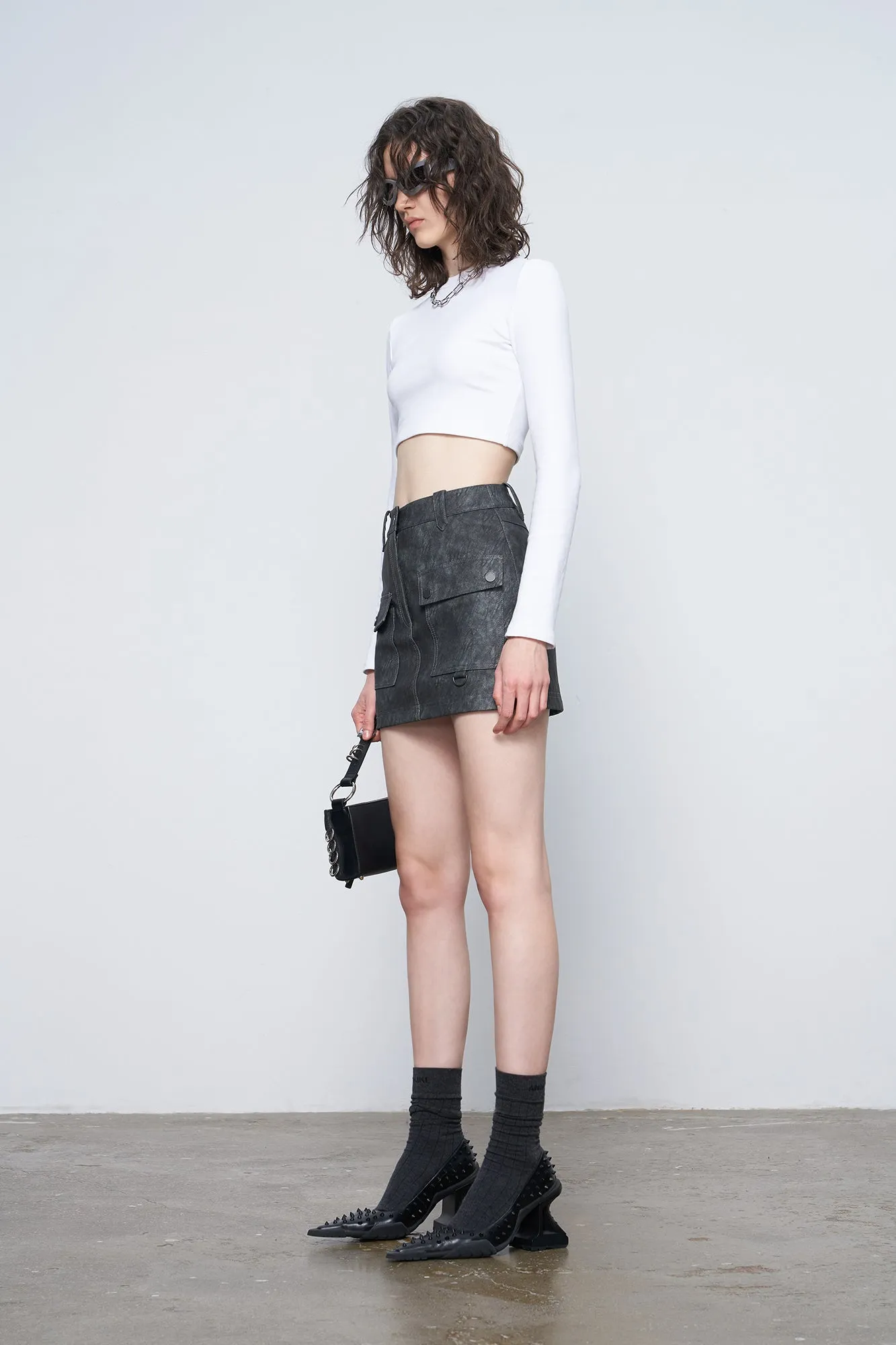 Irregular pocket leather skirt